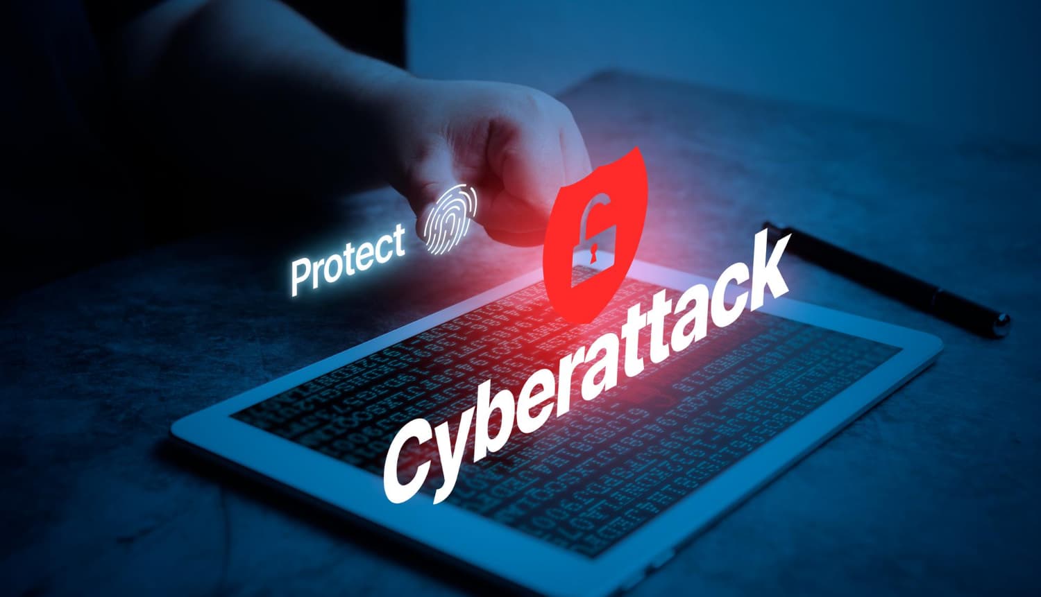 A hand over a tablet streaming code, with a red unlocked shield and the word Cyberattack projected above the screen