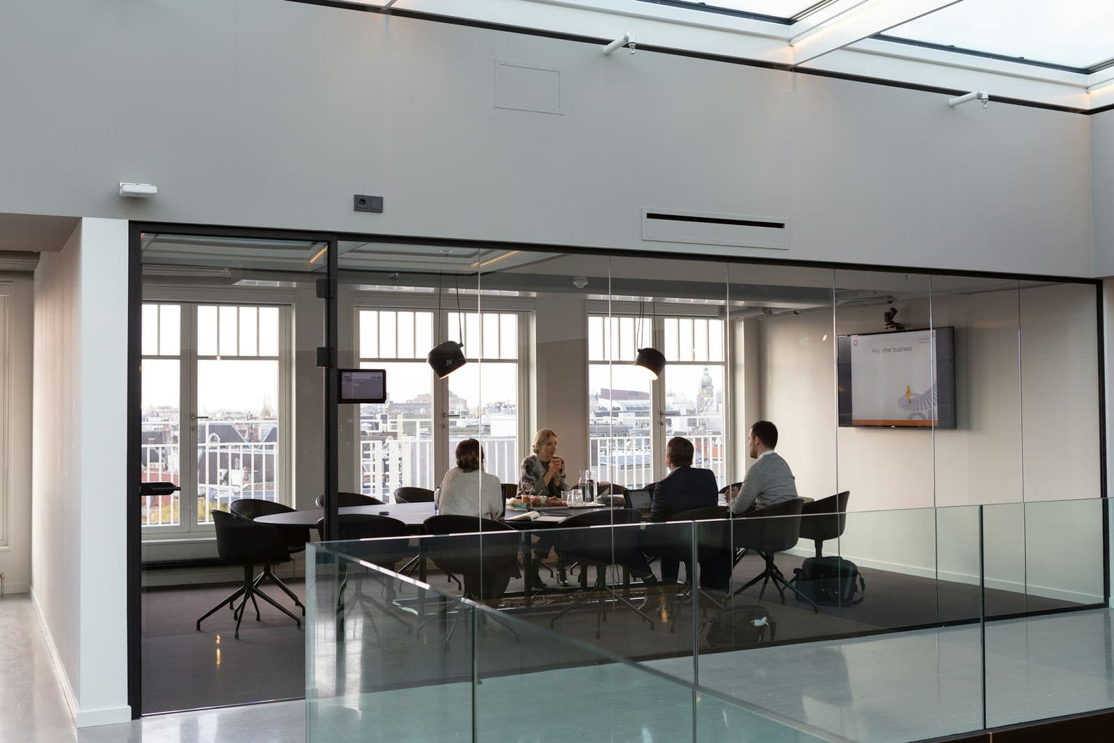 Modern executive boardroom with glass walls overlooking the city