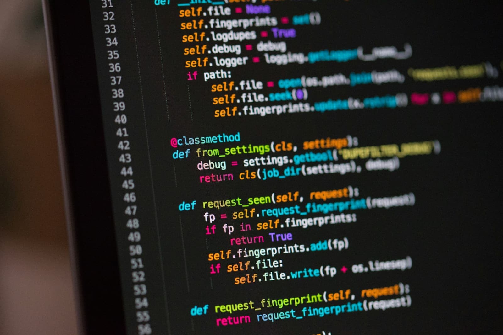 Close-up of source code on a dark screen